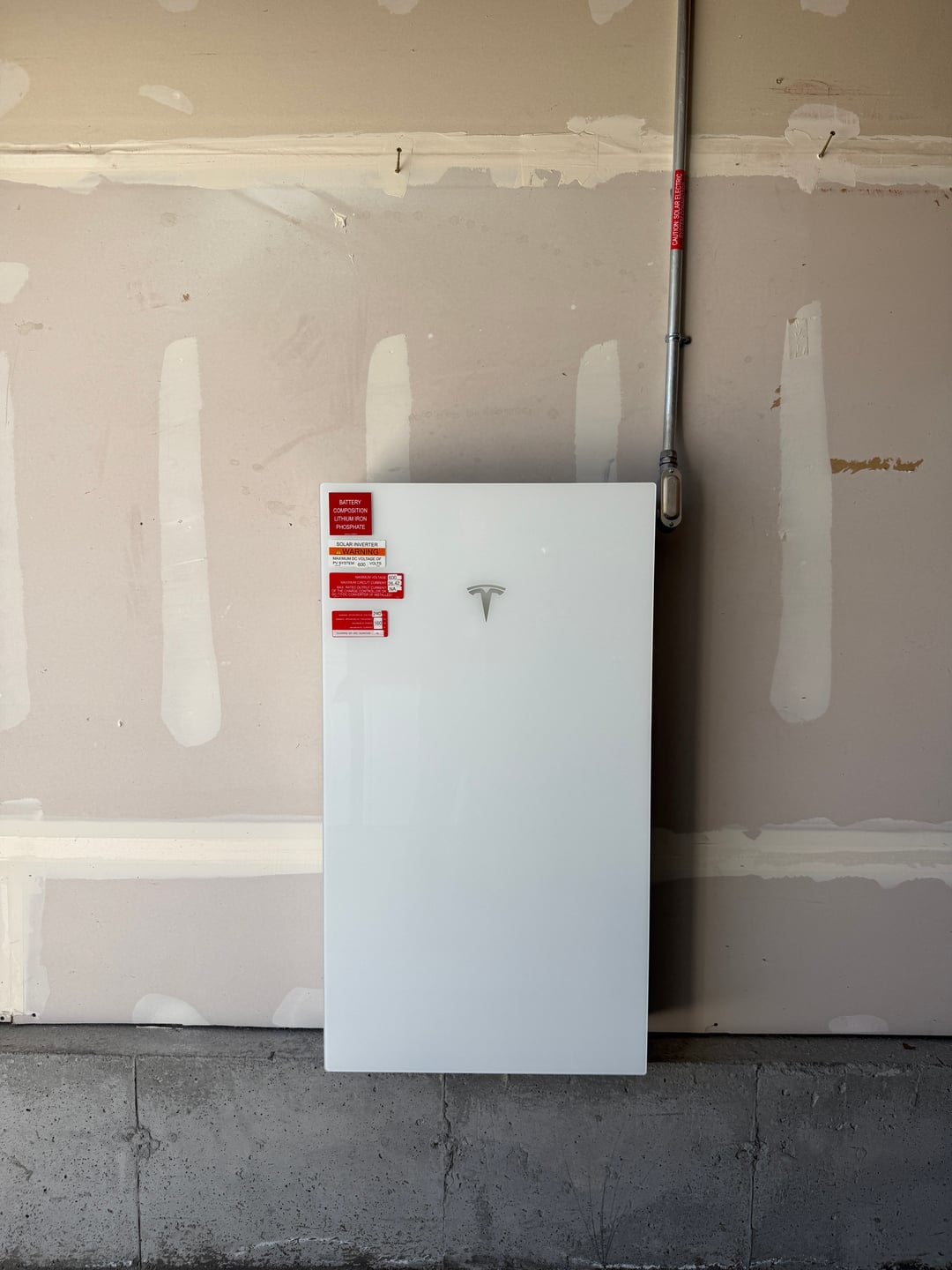 Home battery backup install showing equipment and code labels