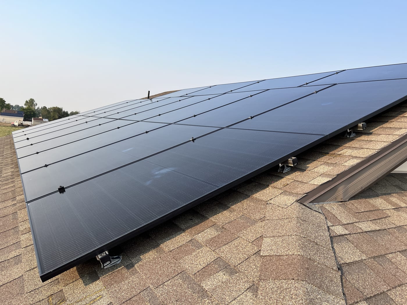 [Trina panels] Solar array with racking system on brick residential roof