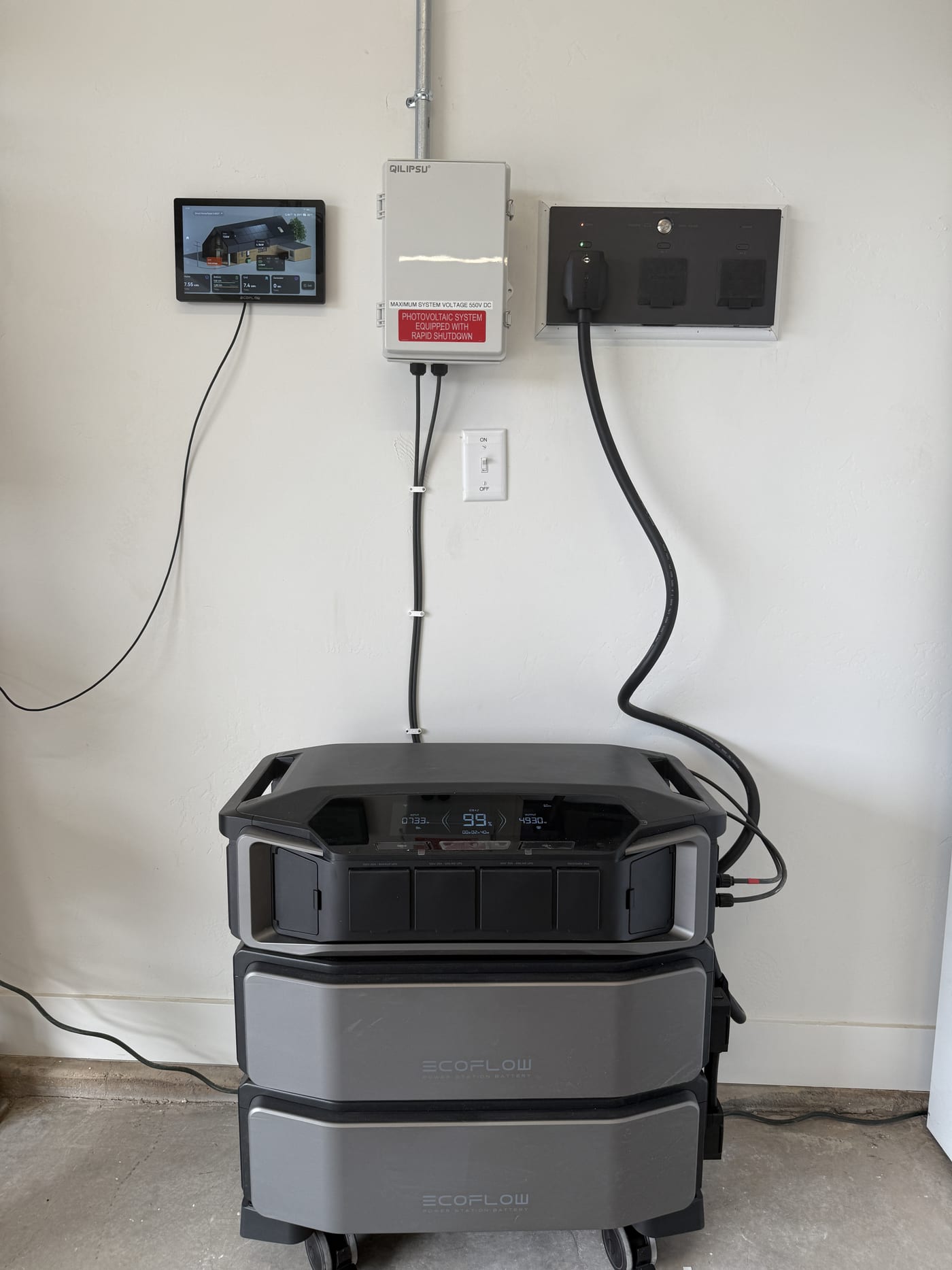 EcoFlow DPU and dual SHP2 batteries showing 99 percent charge on display with caution labels