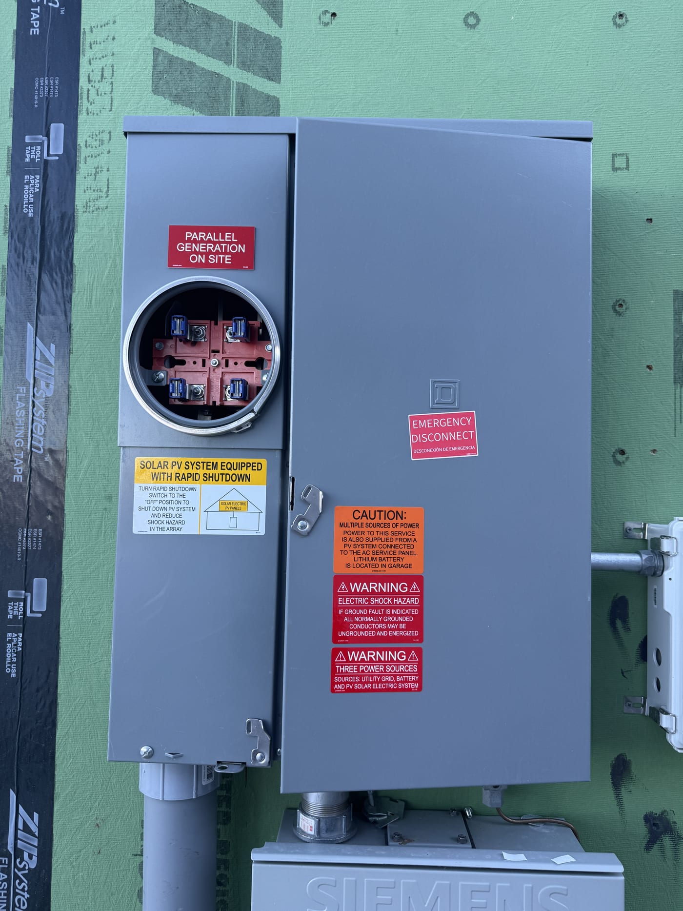 Close-up of Siemens disconnect switch labels showing 240V 53.2A PV AC disconnect specifications