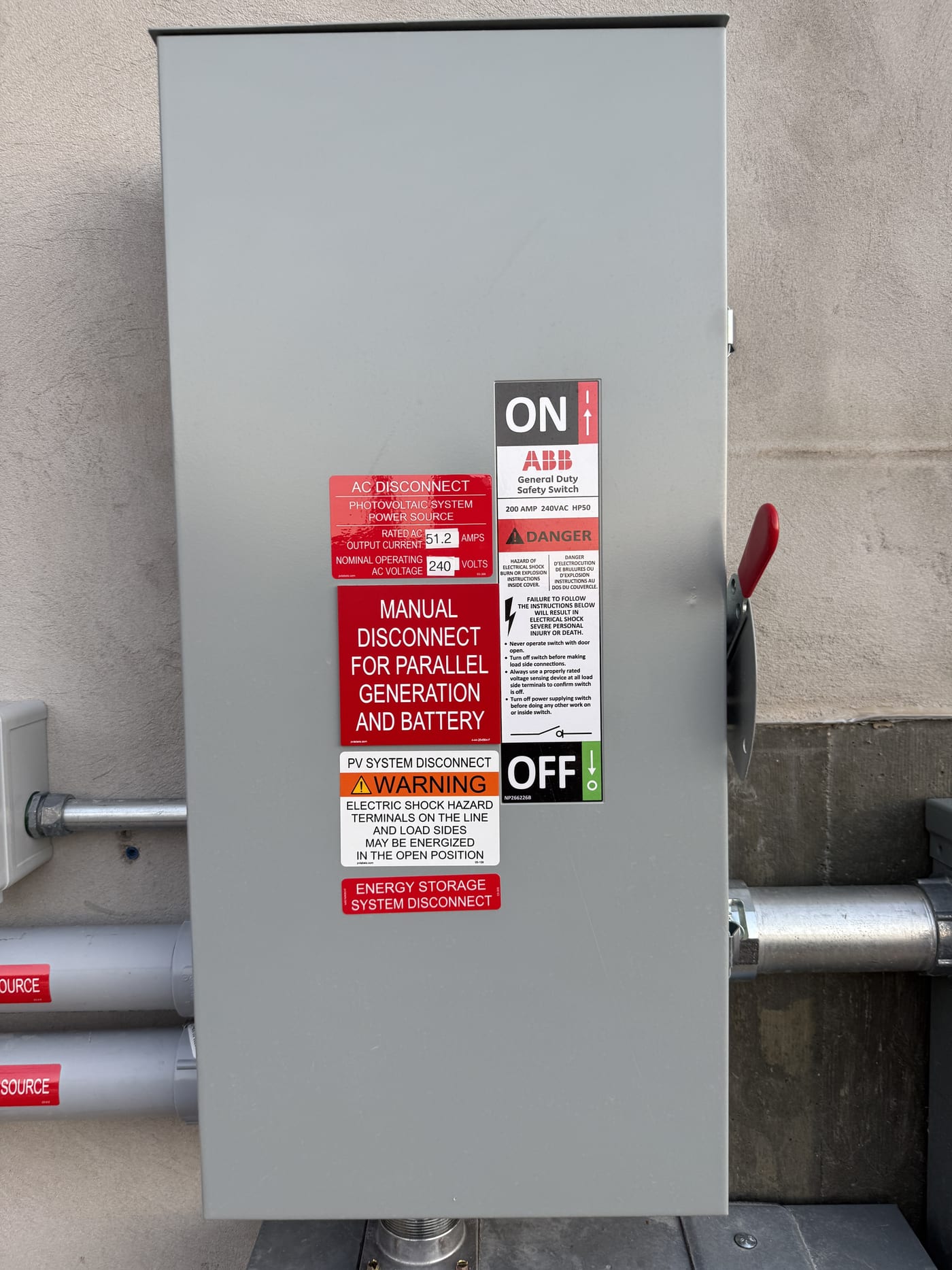 Close-up of ABB disconnect switch with Manual Disconnect for Parallel Generation and Battery label, ON/OFF handle visible